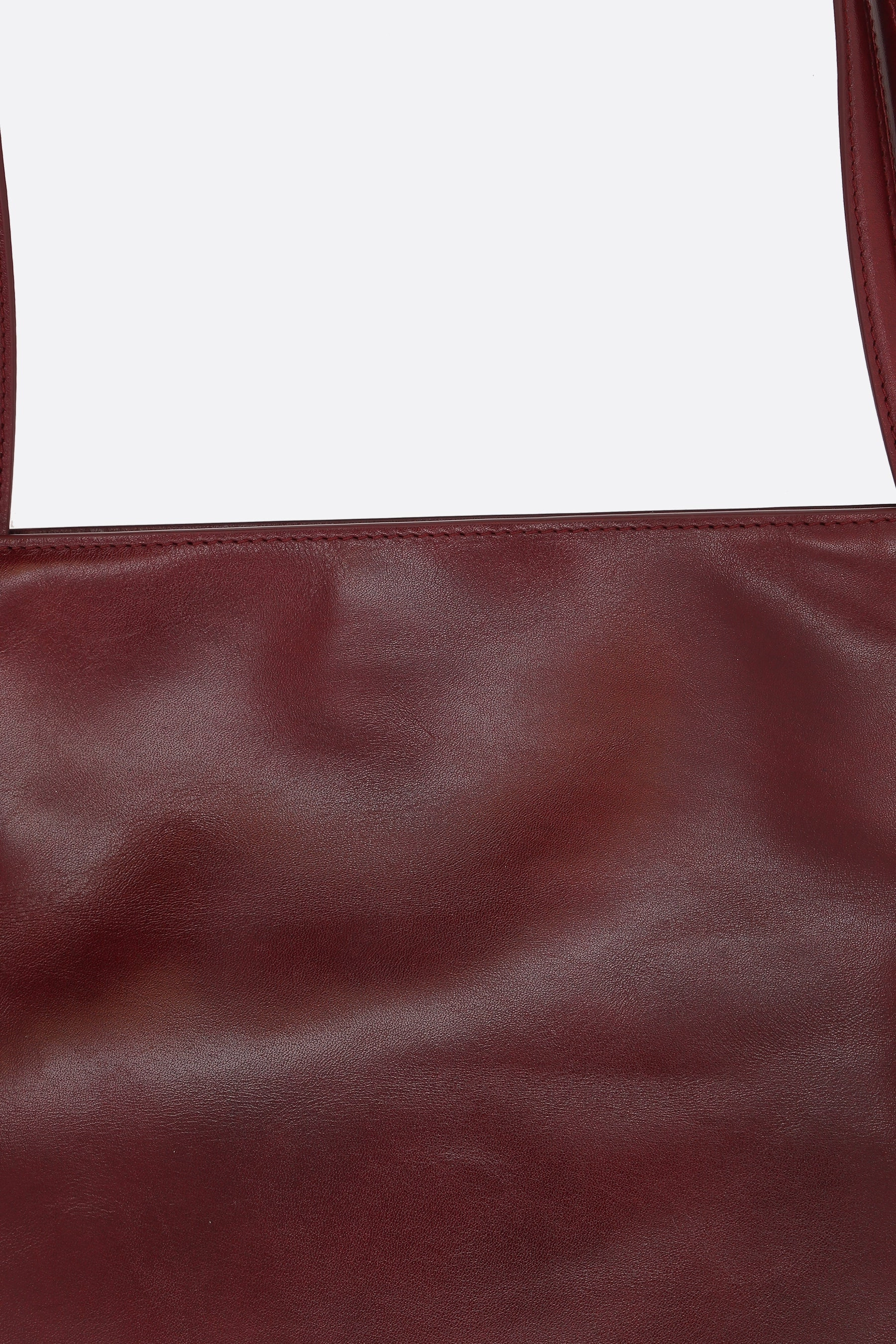 Yumi Sling handbag in glossy leather